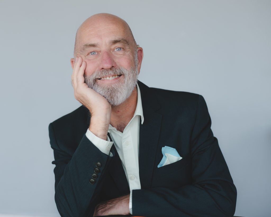 Male Business Owner Portrait - Personal Branding Session Natural light studio personal branding portrait of a smiling male business owner in a navy blazer and pocket square by Sadia Barlow Photography